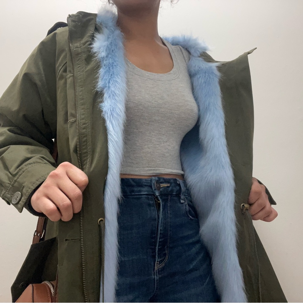 Green jacket with blue fur on the inside